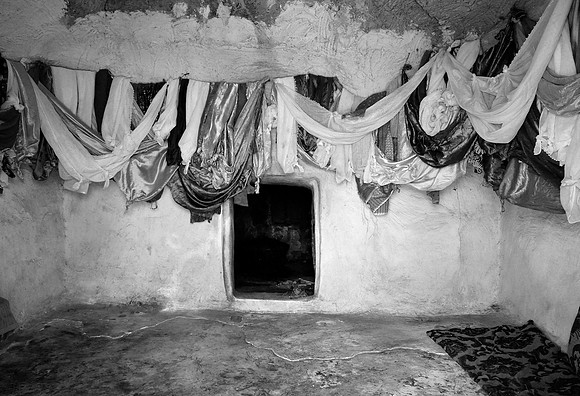 Silk cloths hanging inside Sheikh Qurish qub, Sinjar region (2014)